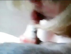 Busty woman licks dog's cock